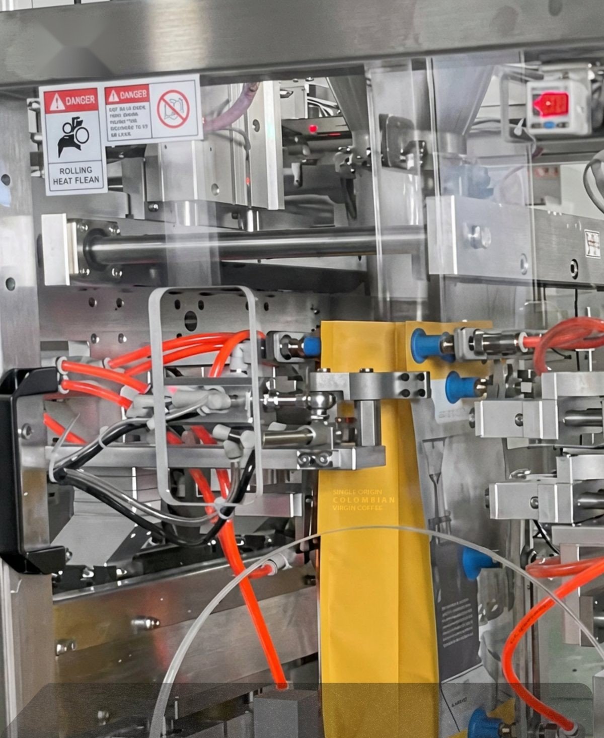 XJENINGS premade-pouch machine filling a single coffee pouch — one-lane configuration
